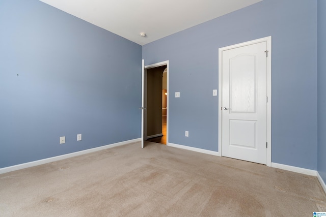 spare room with light carpet