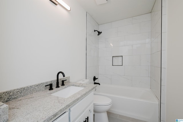 full bathroom with vanity, tiled shower / bath combo, and toilet