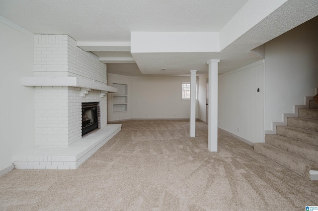 unfurnished living room featuring a brick fireplace, light colored carpet, and a textured ceiling