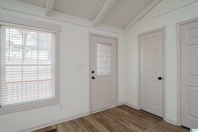 entryway with vaulted ceiling with beams and dark hardwood / wood-style flooring