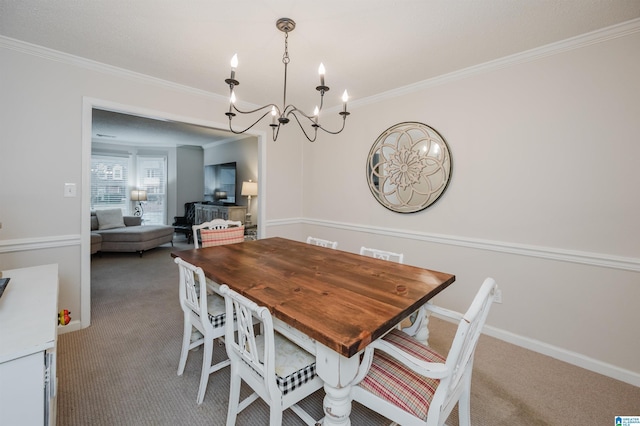 carpeted dining area featuring crown molding and an inviting chandelier