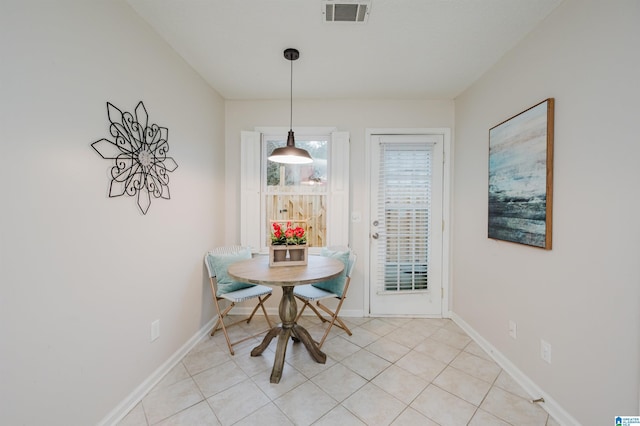 dining area featuring light tile patterned floors