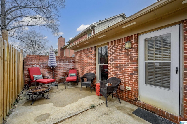 view of patio featuring a fire pit