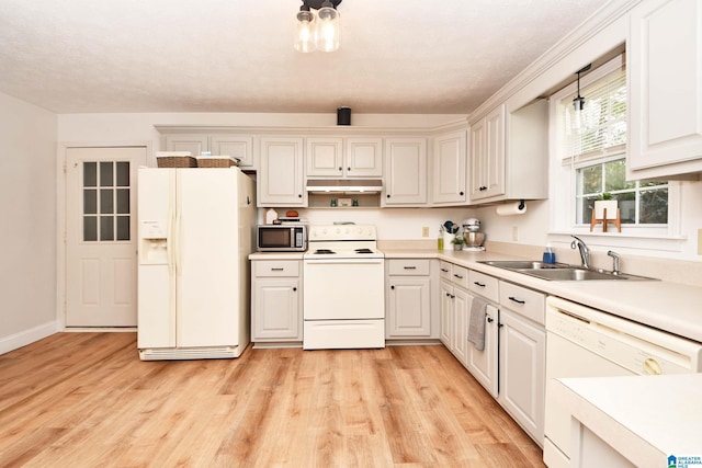 kitchen featuring white cabinetry, sink, white appliances, and light hardwood / wood-style flooring