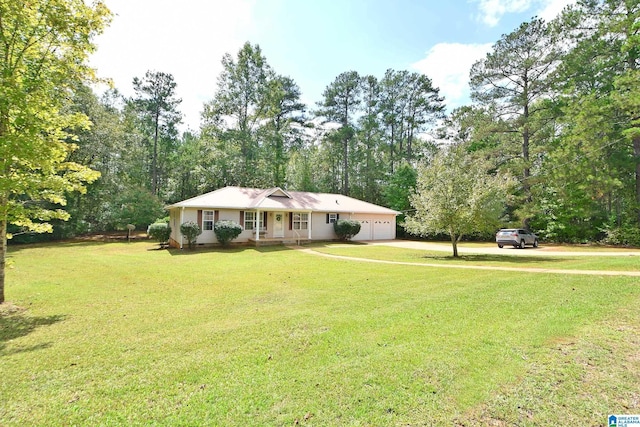 single story home featuring a garage and a front yard