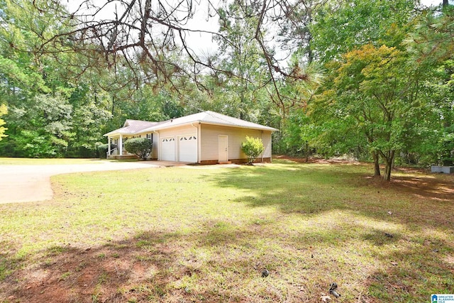 view of yard with a garage