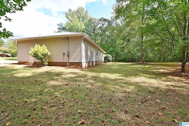 view of property exterior with a yard