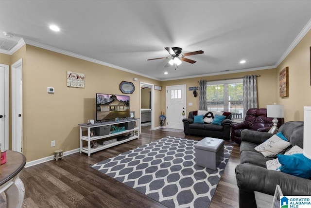 living room with ornamental molding, dark hardwood / wood-style floors, and ceiling fan