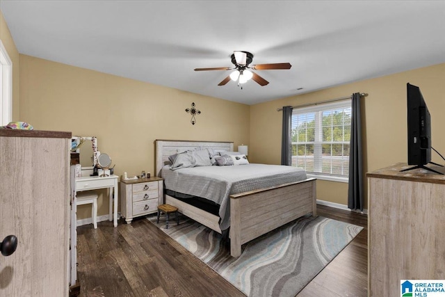 bedroom with dark wood-type flooring and ceiling fan