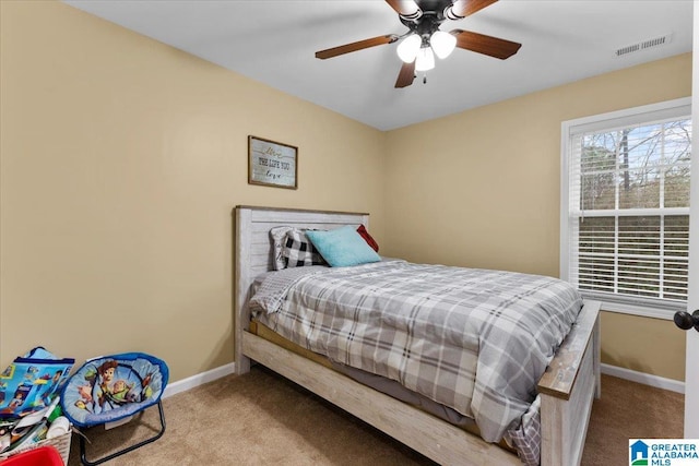 bedroom featuring ceiling fan and light colored carpet