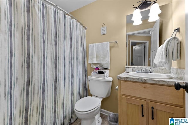 bathroom with vanity, toilet, and a shower with shower curtain