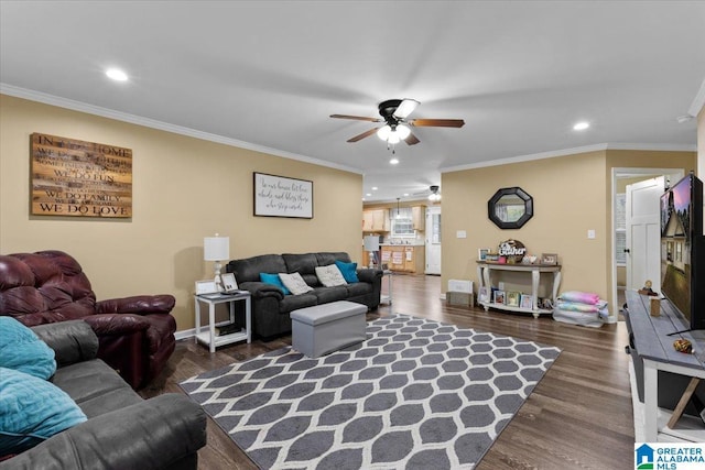 living room with crown molding, dark wood-type flooring, and ceiling fan