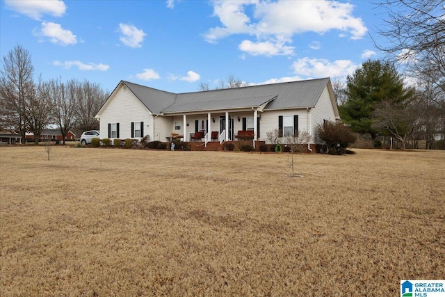 ranch-style home featuring a porch and a front yard