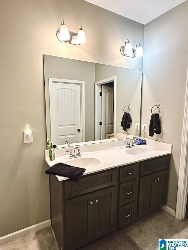 bathroom with tile patterned floors and vanity