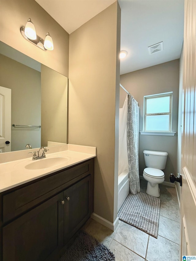 full bathroom with vanity, shower / tub combo with curtain, tile patterned floors, and toilet