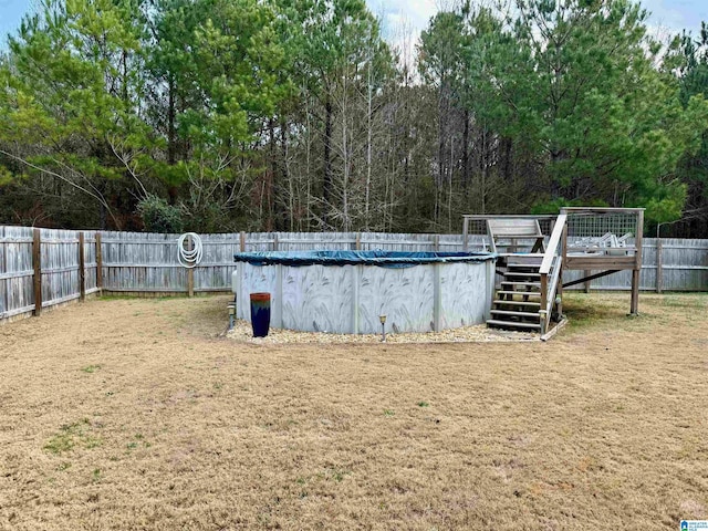 view of yard with a covered pool