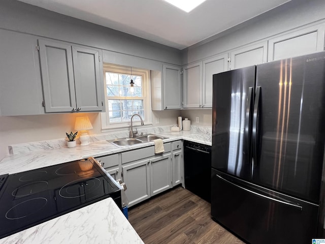 kitchen featuring sink, dishwasher, electric range oven, fridge, and dark hardwood / wood-style floors