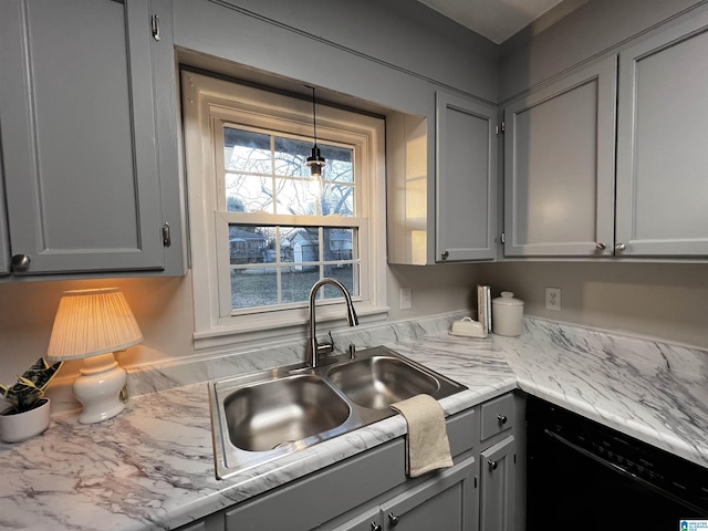 kitchen featuring gray cabinets, pendant lighting, black dishwasher, and sink