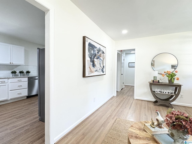 hall with light wood-type flooring