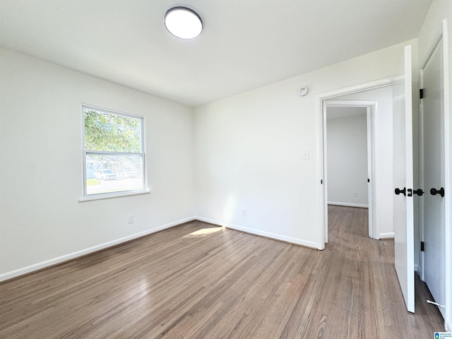 unfurnished room featuring light hardwood / wood-style flooring