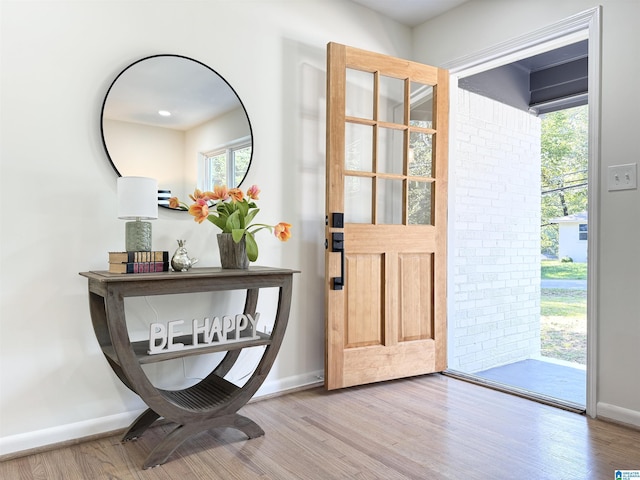 doorway with hardwood / wood-style floors