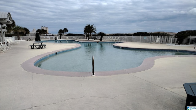 view of swimming pool featuring a patio