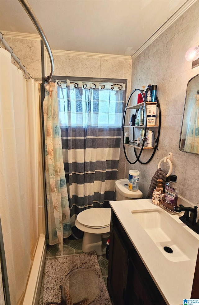 bathroom with vanity, crown molding, toilet, and walk in shower