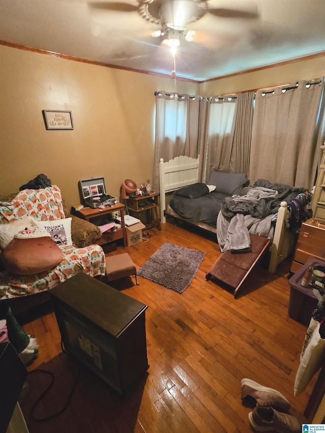 bedroom with wood-type flooring and ceiling fan