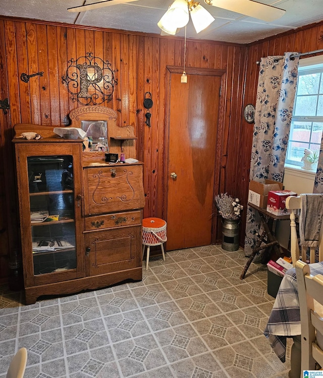 sitting room featuring wooden walls