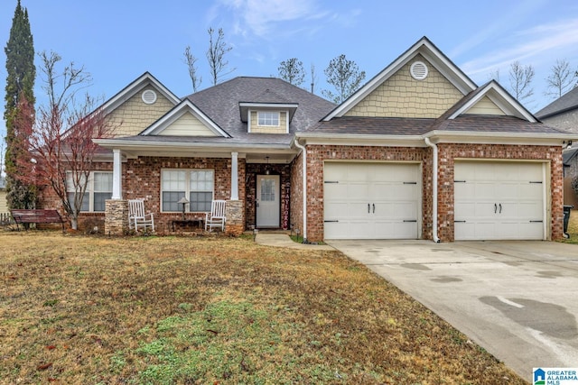 craftsman house with a garage and a front yard