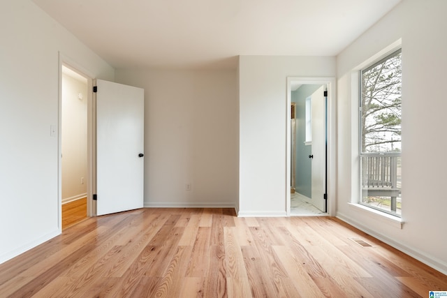 unfurnished room with light hardwood / wood-style floors