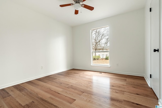 unfurnished room featuring ceiling fan and light wood-type flooring