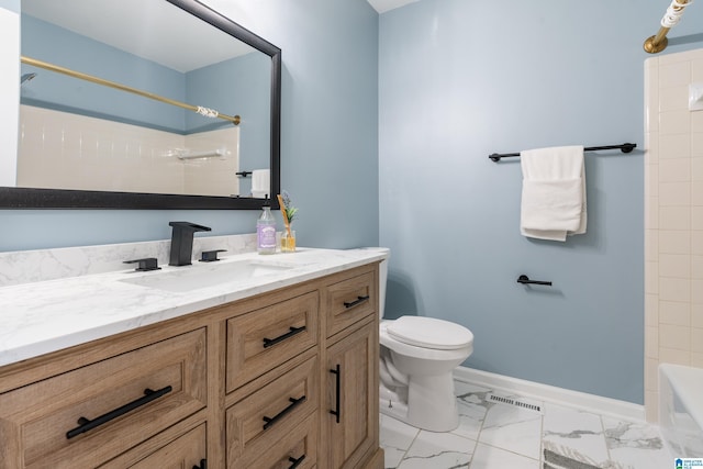 bathroom with vanity and toilet