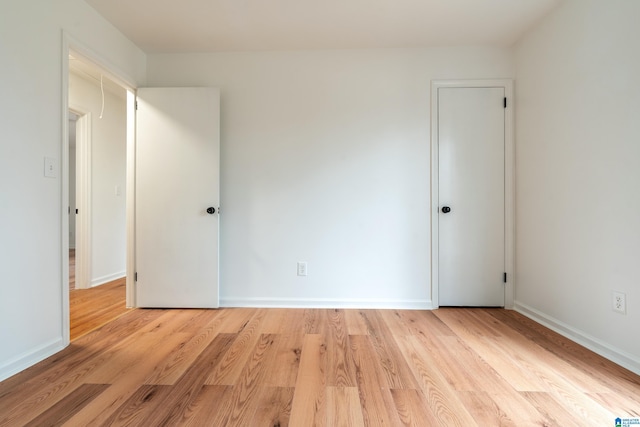 unfurnished room featuring light wood-type flooring