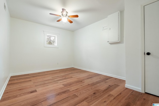 spare room with light hardwood / wood-style flooring and ceiling fan