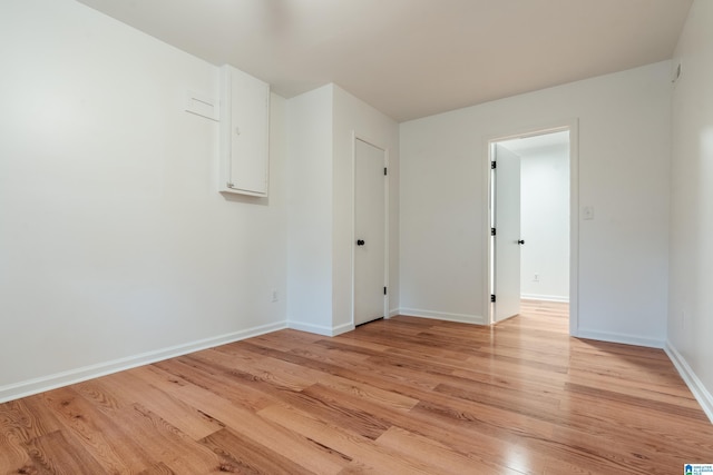 unfurnished room with light hardwood / wood-style floors