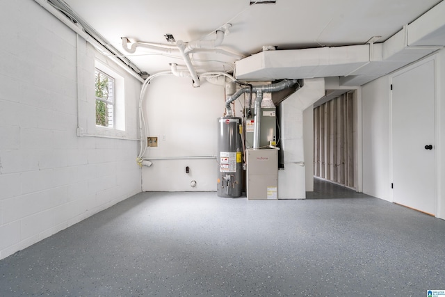 basement featuring heating unit and gas water heater