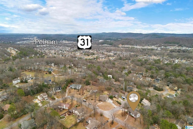 drone / aerial view featuring a mountain view