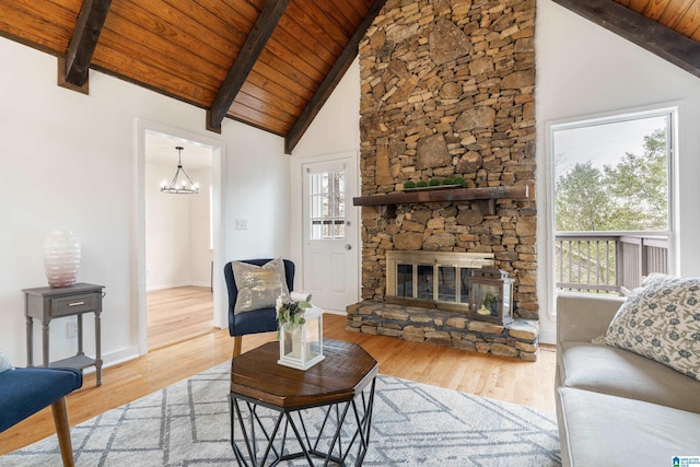 living room with high vaulted ceiling, wooden ceiling, beam ceiling, and light hardwood / wood-style floors