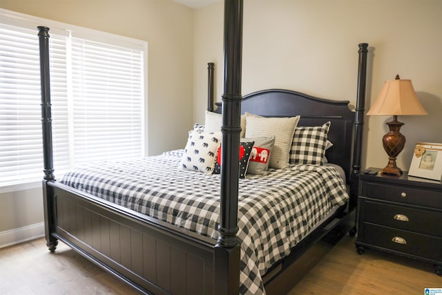 bedroom with light hardwood / wood-style flooring