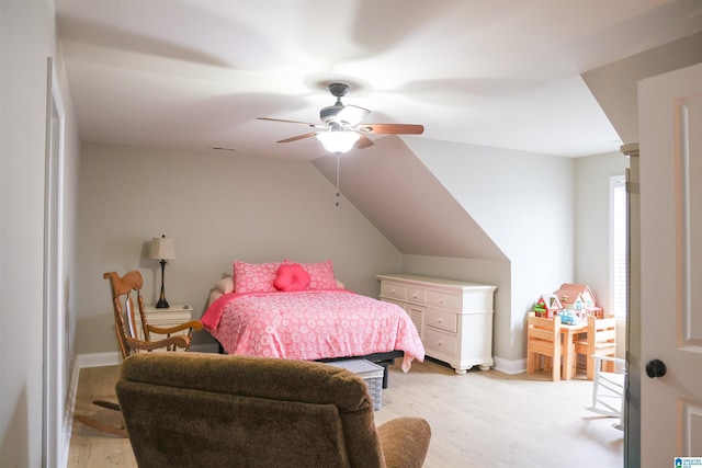 bedroom featuring ceiling fan, lofted ceiling, and light hardwood / wood-style floors