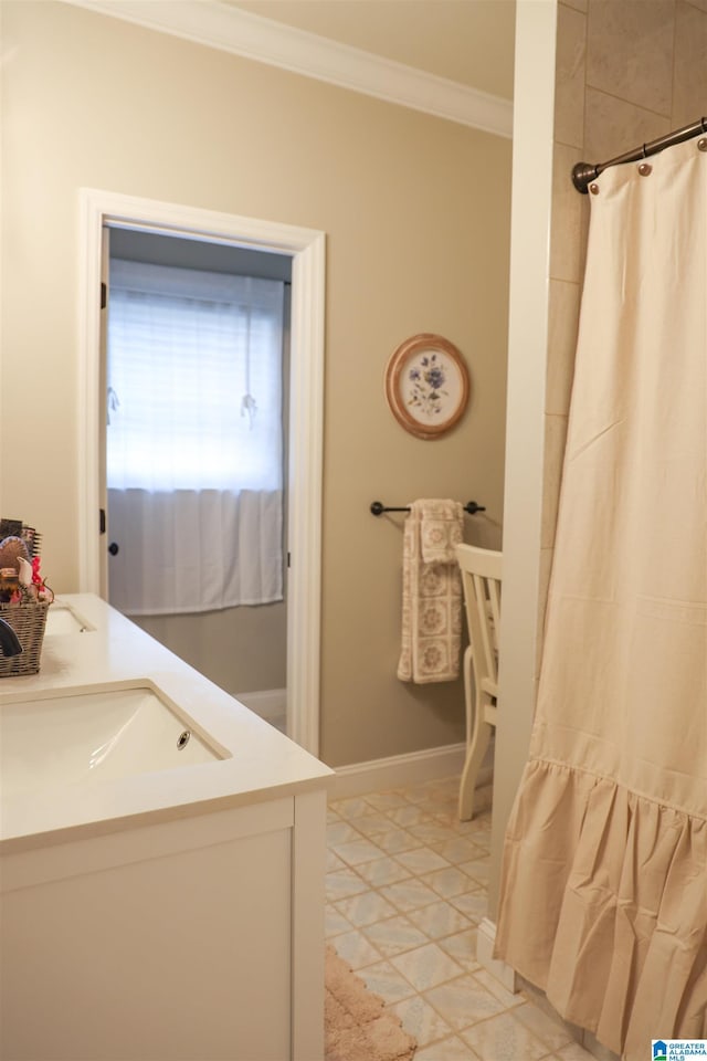 bathroom featuring walk in shower, ornamental molding, tile patterned flooring, and vanity