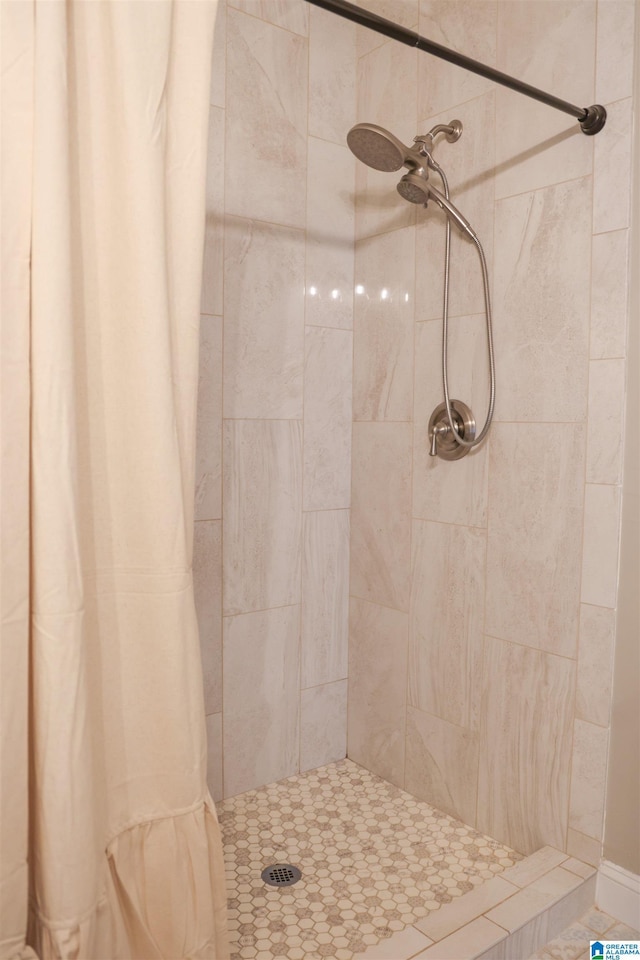 bathroom featuring curtained shower