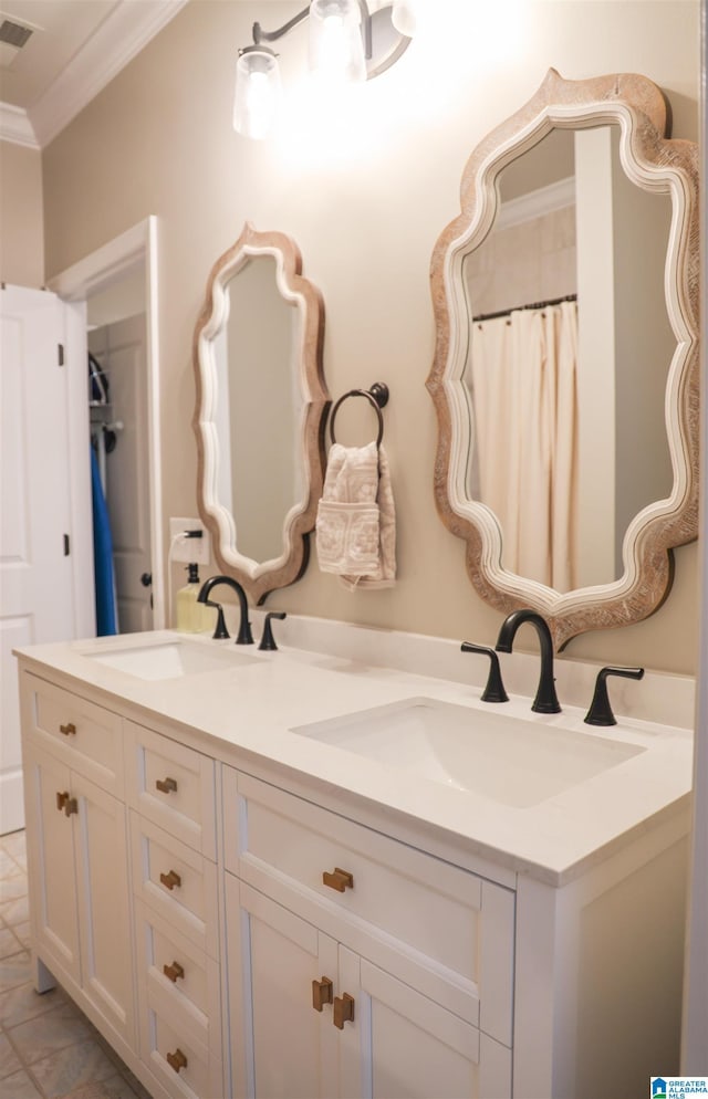 bathroom with ornamental molding and vanity