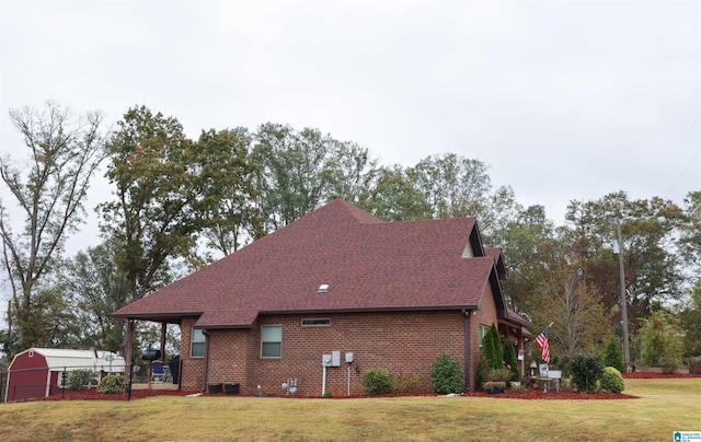 view of side of property with a yard