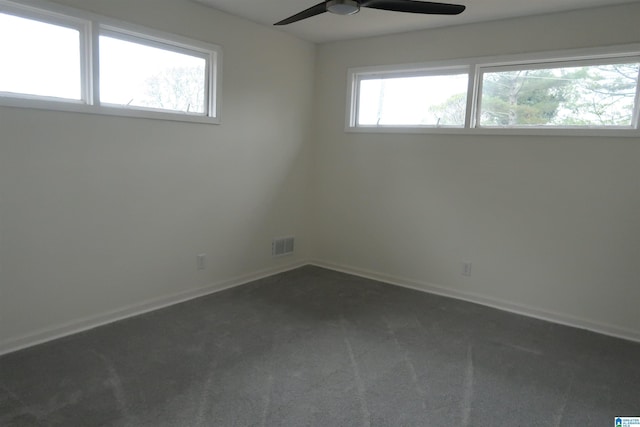 carpeted empty room featuring ceiling fan