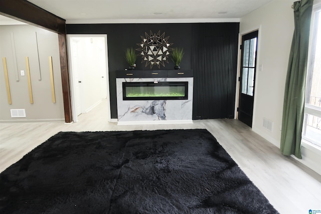 unfurnished living room with light wood-type flooring