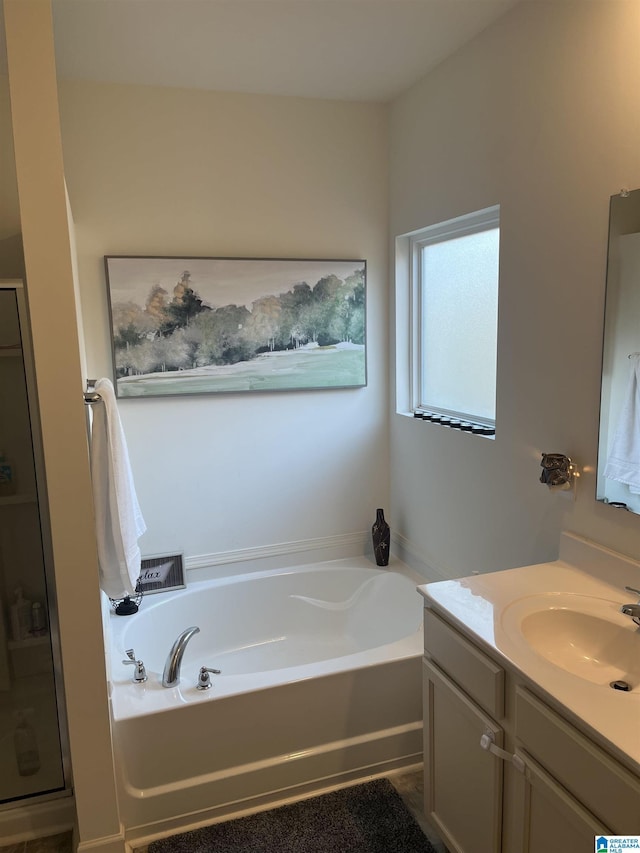 bathroom featuring vanity and plus walk in shower