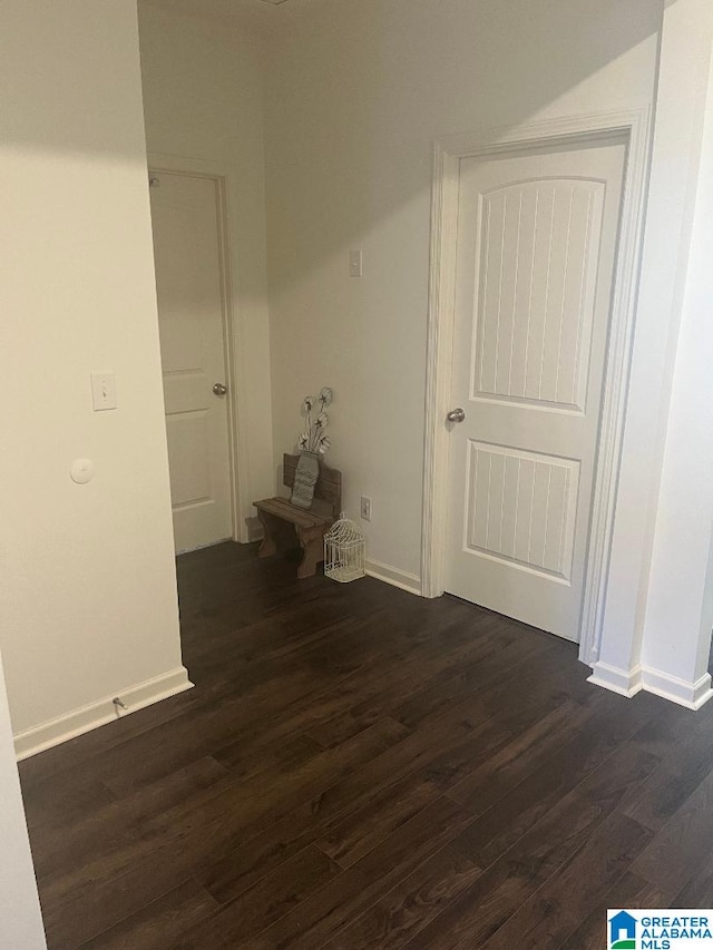 hallway featuring dark hardwood / wood-style flooring