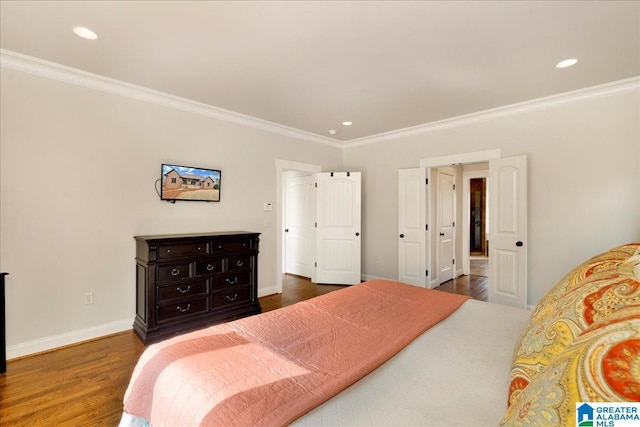 bedroom with dark hardwood / wood-style flooring and ornamental molding